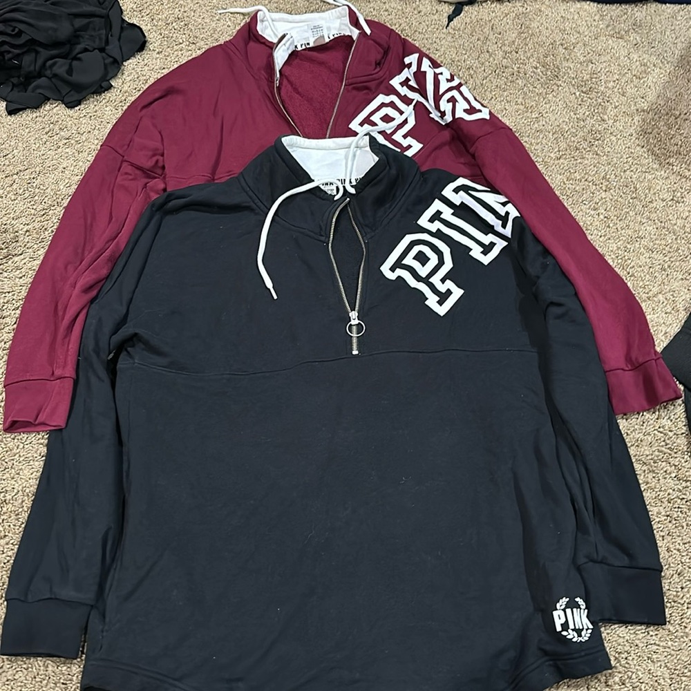 Pink Quarter zip. Size Large. Lightly used. Black and burgundy. Pockets on side.